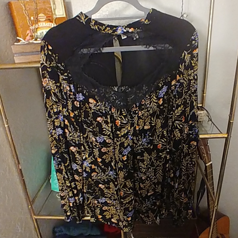 A black floral print top with chest cut out